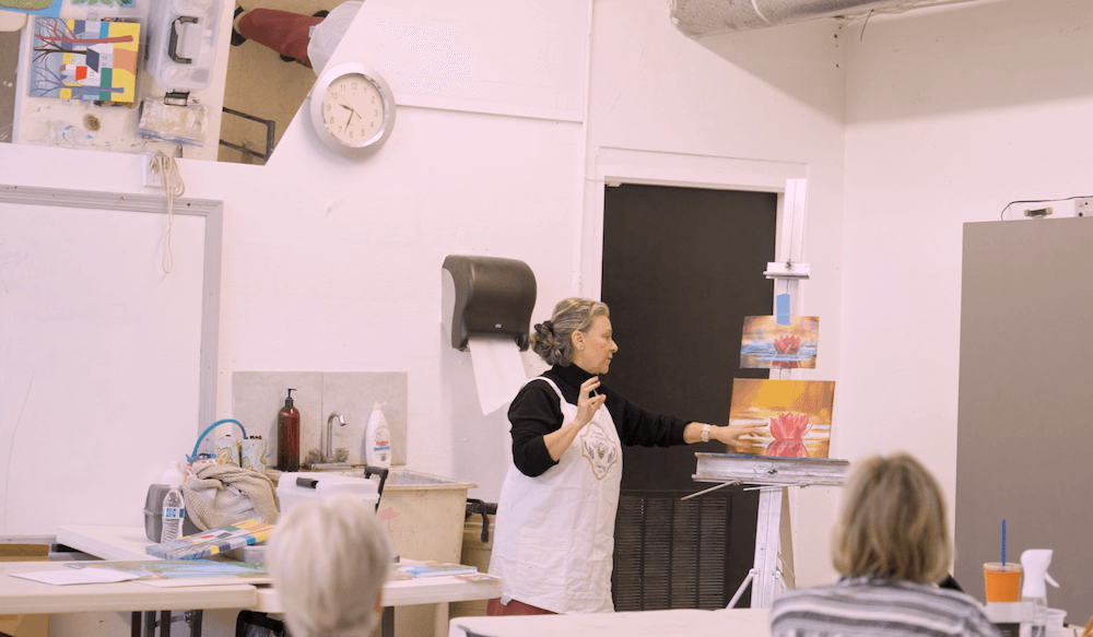 woman teaching a painting class